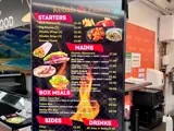 A menu board at a kebab shop 