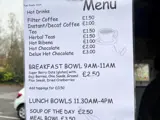 An image of a menu held up with a bulldog clip